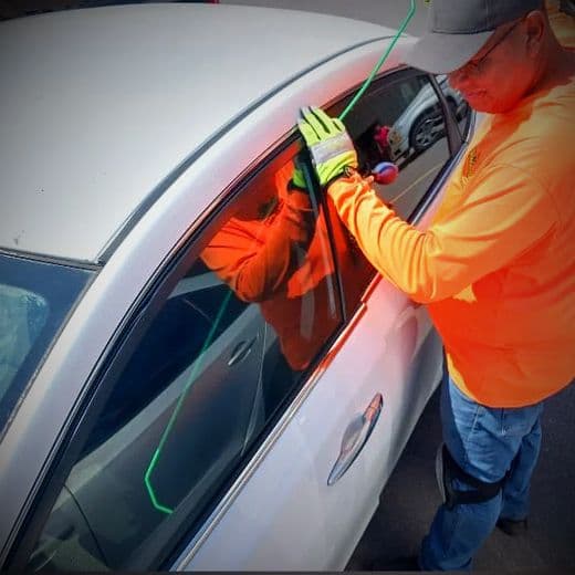 Alaniz Roadside technician unlocking a vehicle